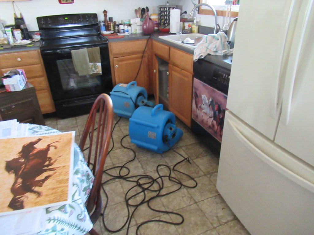 industrial equipment clearing water from kitchen floor - Branson, MO